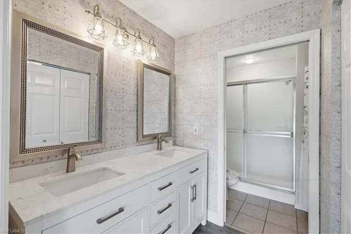 new quartz dual vanity, mirrors, custom designer wall coverings, self-close dovetailed drawers