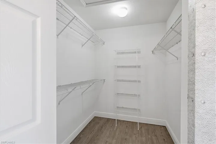 large walk-in closet in primary bedroom