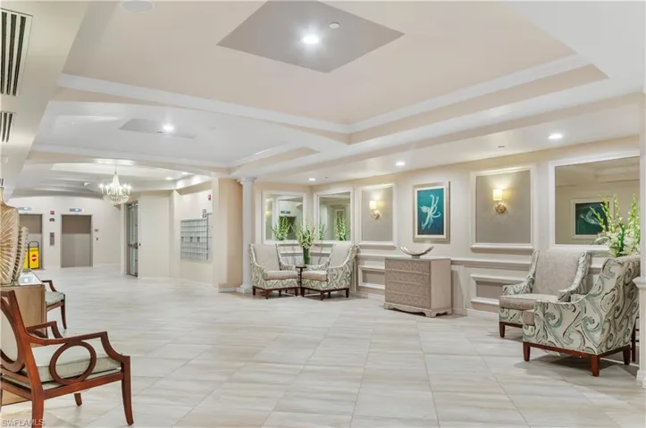 Lobby with crown molding and recessed lighting