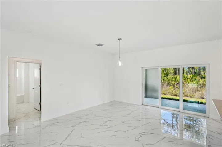 Empty room with light marble finish floors and baseboards