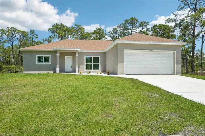 Modern-style home with stucco siding, a garage, concrete driveway, a front yard, and a shingled roof