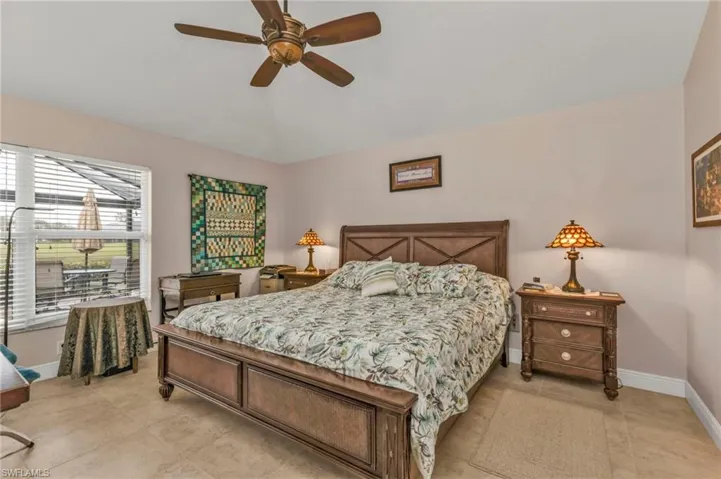 Tiled bedroom with ceiling fan