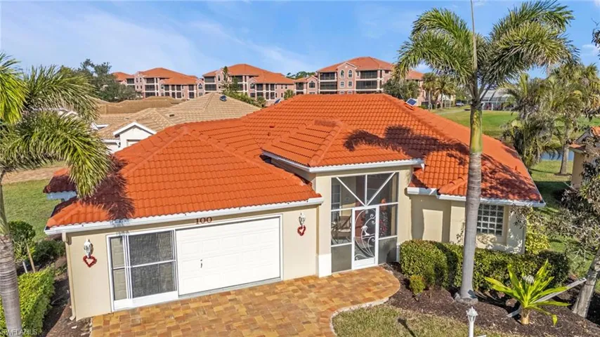 Mediterranean / spanish-style house with a garage