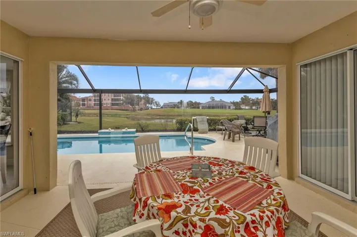 View of pool with ceiling fan