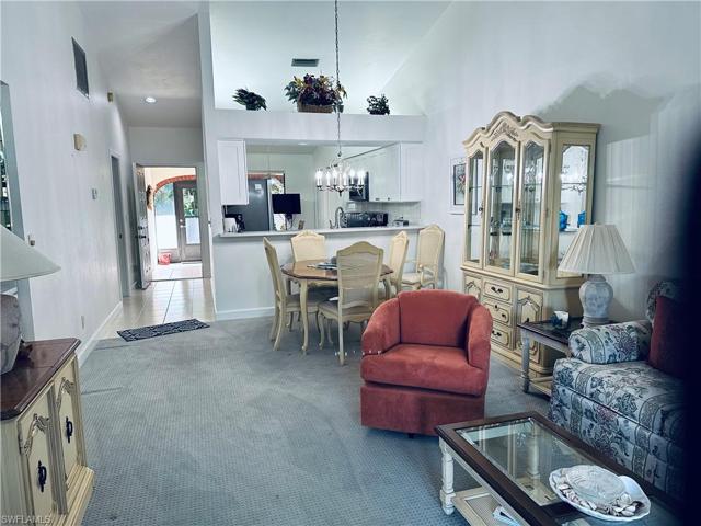 Living room into dining with kitchen pass through