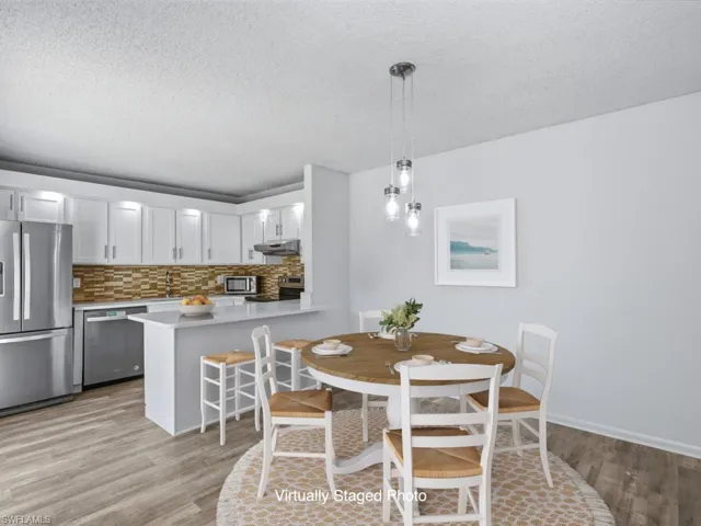 Virtually Staged Dining Room with natural light throughout