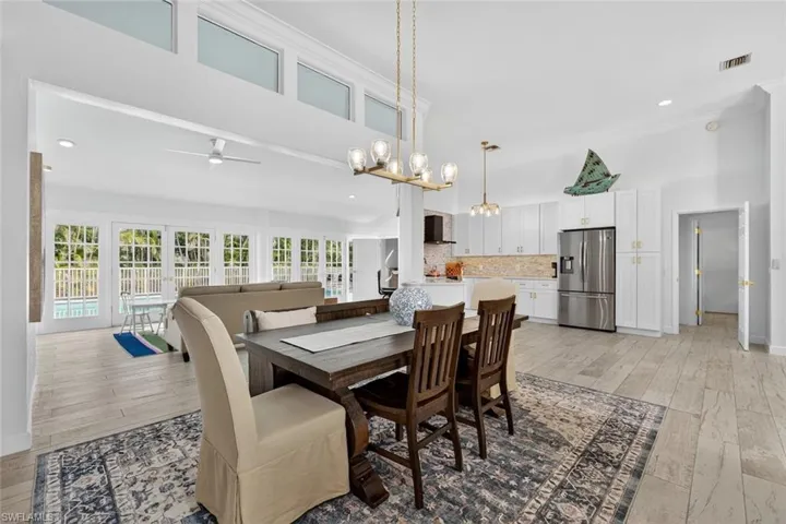 Open dining room with high ceilings and natural light