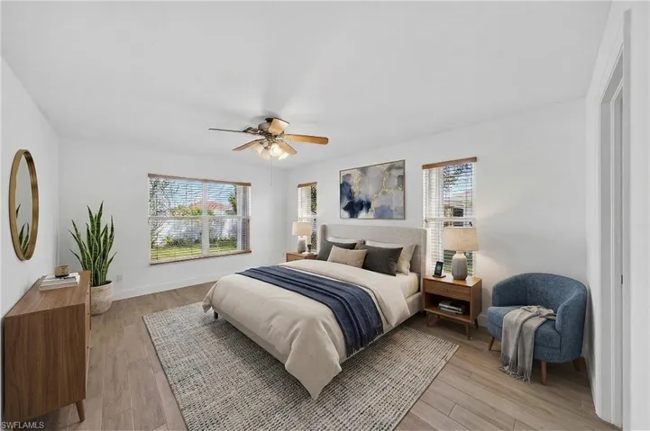 Bedroom with light wood-style floors and ceiling fan