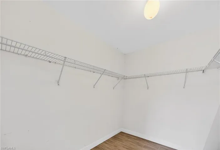 Walk in closet featuring light wood finished floors