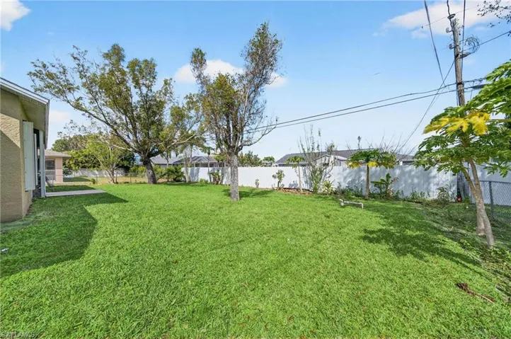 View of fenced backyard