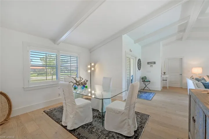 Dining area featuring light wood finished floors and baseboards