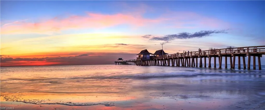 Dock area featuring a water view and a pier