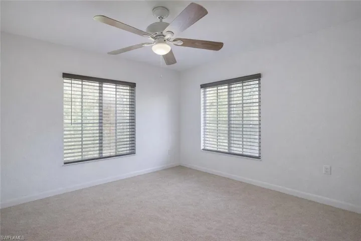 Spare room featuring plenty of natural light and light tile patterned floors