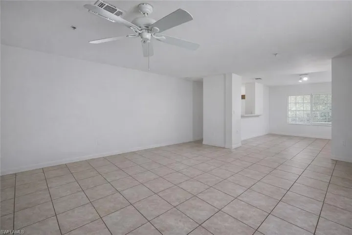 Bathroom with light tile patterned floors and a textured ceiling