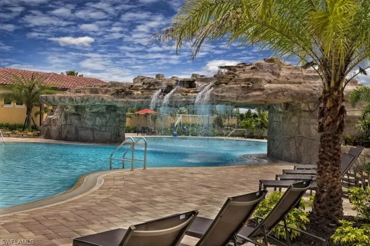 View of swimming pool featuring pool water feature