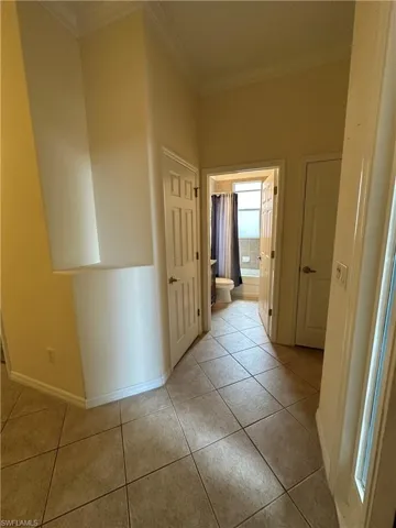 Front entry looking into the guest bathroom. 2 Closets in this hallway