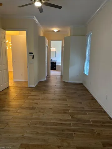 Master bedroom with walk in closets flanking hallway to the master bath