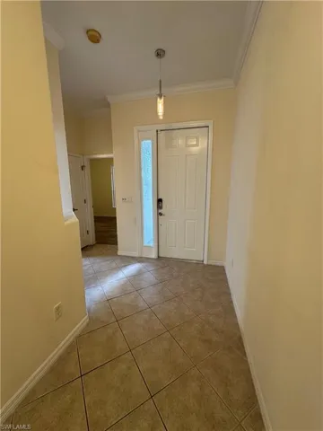 Entry hall looking back towards front door, guest bedroom and bathroom