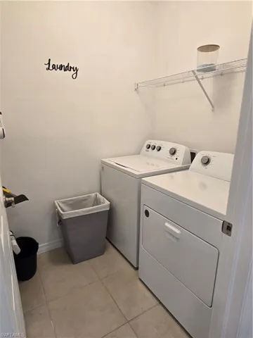 Laundry room featuring separate washer and dryer