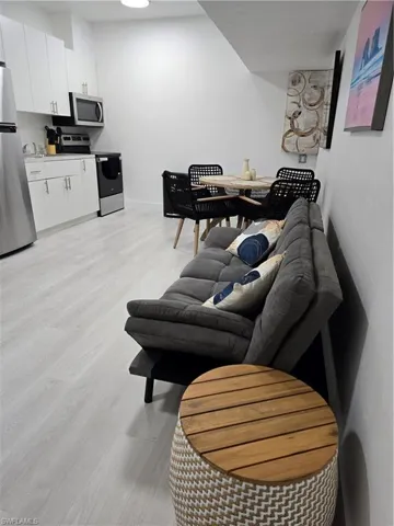 Living room with light wood-type flooring