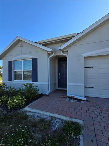 Property entrance featuring a garage