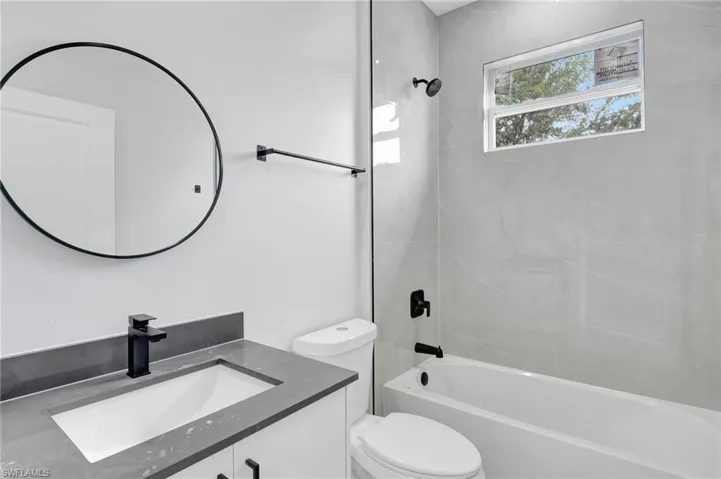 Full bath with  shower combination and vanity