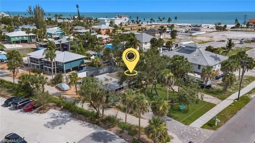 Aerial view with a water view and a residential view virtually enhanced image