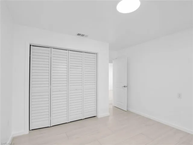 Unfurnished bedroom with a closet