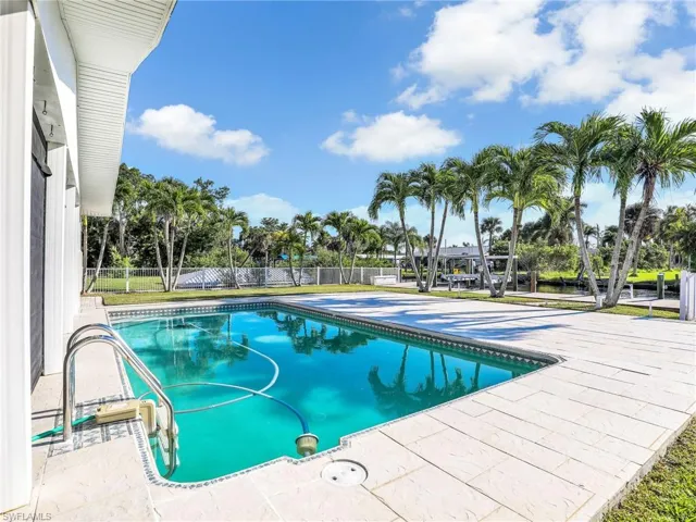 View of swimming pool with a patio area