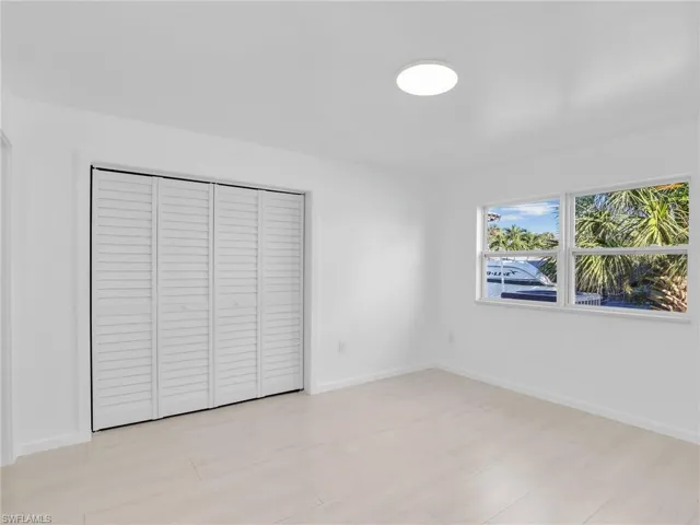 Unfurnished bedroom with a closet