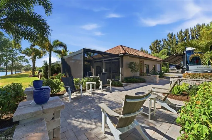View of patio / terrace featuring a lanai, a sunroom, and a water view
