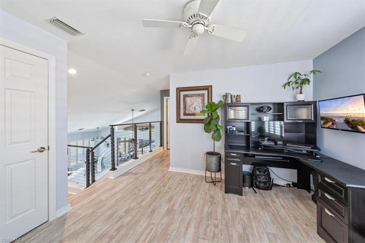 At the top of the stairs, the open loft area offers the perfect spot for a second living space, office, home gym, or TV loft.