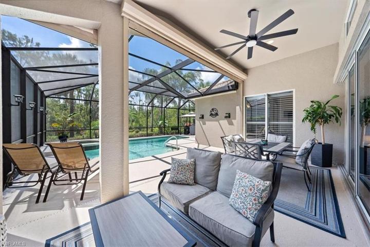 Welcome to 9020 Shadow Glen Way outdoor living! The covered living area opens up to the heated swimming pool with private landscaped rear yard.
