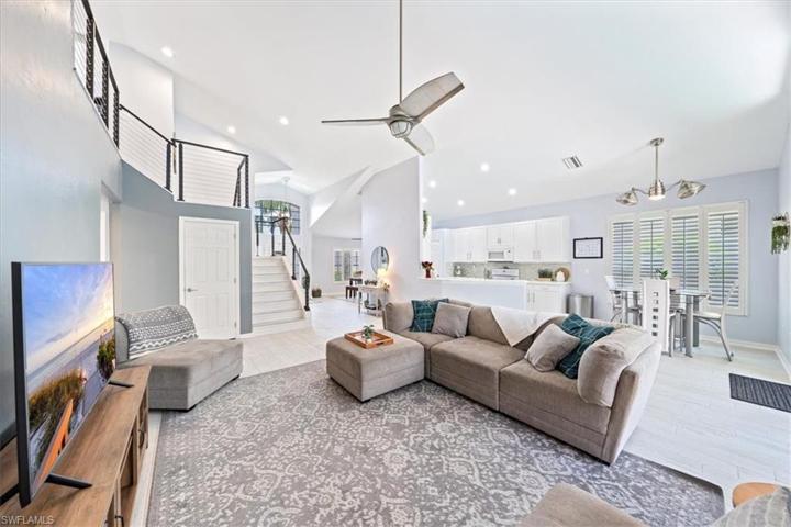 From the primary suite, the great room anchors the main living area and opens up to the kitchen, breakfast nook, and outdoor living and swimming pool.