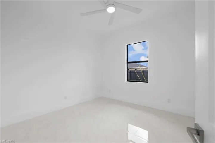 Unfurnished room featuring ceiling fan