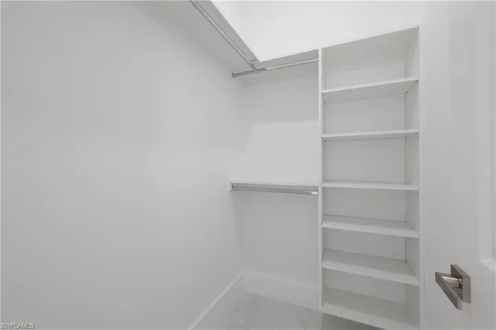 Spacious closet featuring tile patterned floors