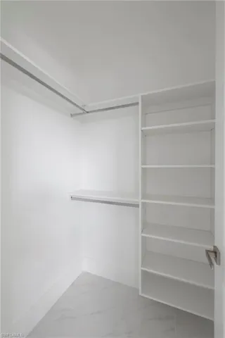 Spacious closet with tile patterned floors