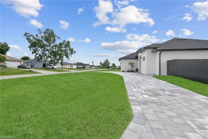 View of yard featuring a garage
