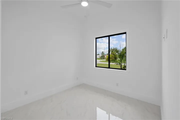 Empty room featuring ceiling fan