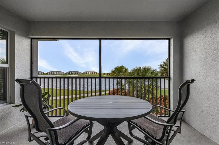 Screened lanai overlooking lake & golf course