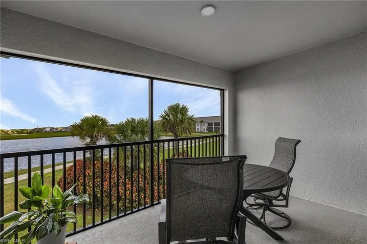 Screened lanai overlooking lake & golf course