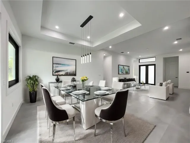 Dining space with a tray ceiling