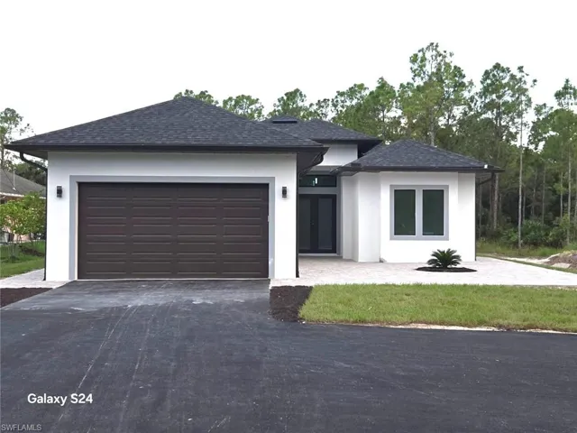 Prairie-style house featuring a garage