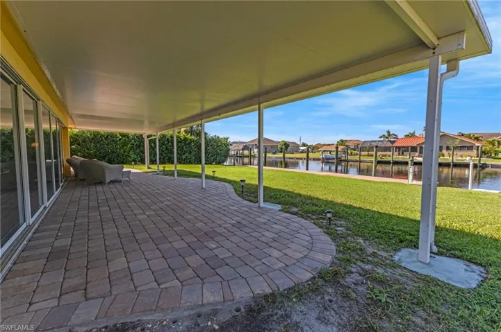 View of patio / terrace featuring a water view and a residential view