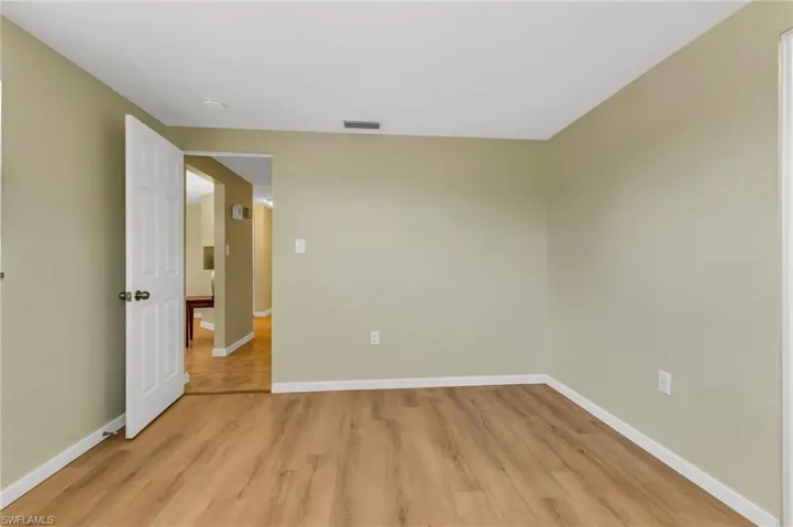Empty room featuring light wood finished floors