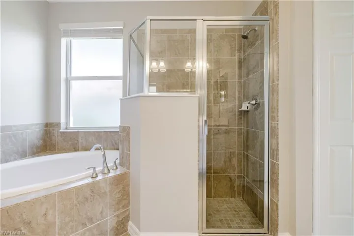 Large Tub and Spacious Walk-in Shower