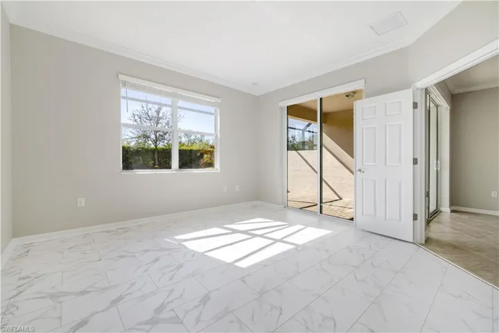 Beautiful natural light, double entry doors and sliding glass doors out to screened patio