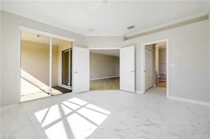 Beautiful natural light, double entry doors and sliding glass doors out to screened patio