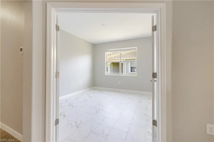 Glass French Doors leading into Den