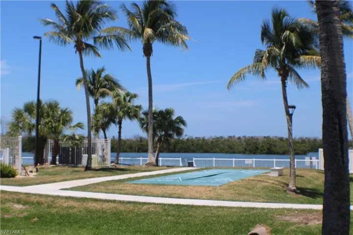 View of swimming pool featuring a yard